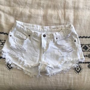 White denim shorts, distressed style
